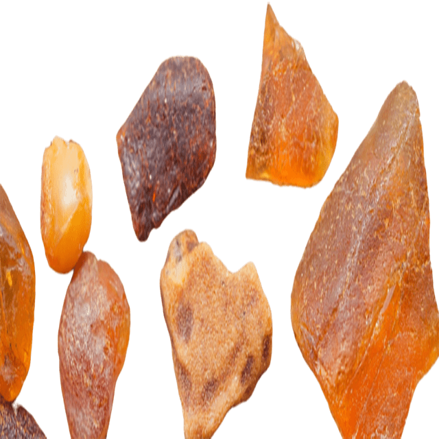 A collection of amber pieces, likely used as natural ingredients in the fragrance oil blend.
